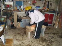 Marianne chisels the hull. Photograph: Douglas Cecil